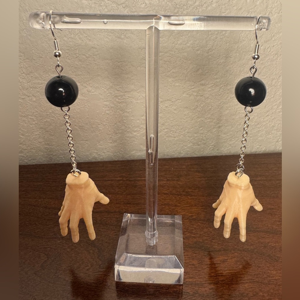 Addams family thing hand earrings